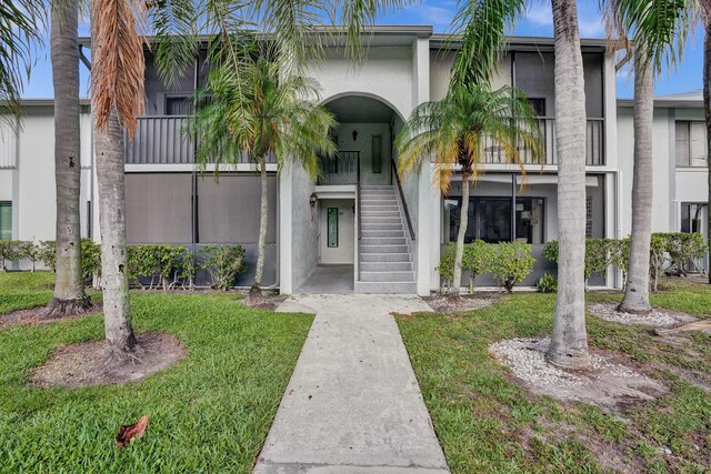 1013 Green Pine Blvd Unit A1, West Palm Beach, FL 33409 - view of property with stairs