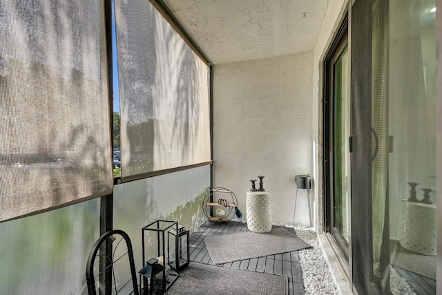 1013 Green Pine Blvd Unit A1, West Palm Beach, FL 33409 - unfurnished sunroom with a textured wall and wood finished floors