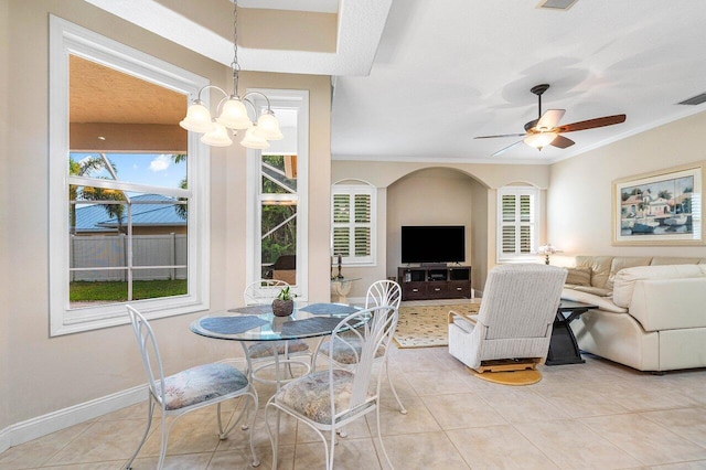 2020 Newhaven Ave, Wellington, FL 33414 - dining space featuring crown molding, light tile patterned floors, a ceiling fan, and baseboards