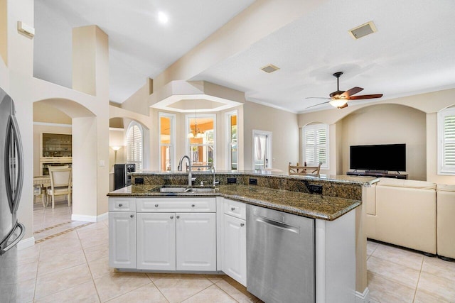 2020 Newhaven Ave, Wellington, FL 33414 - kitchen with appliances with stainless steel finishes, a sink, open floor plan, and dark stone countertops