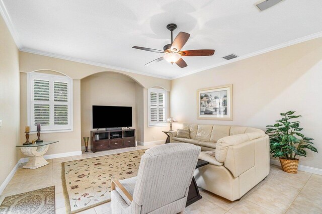 2020 Newhaven Ave, Wellington, FL 33414 - living room featuring light tile patterned floors, plenty of natural light, crown molding, and baseboards