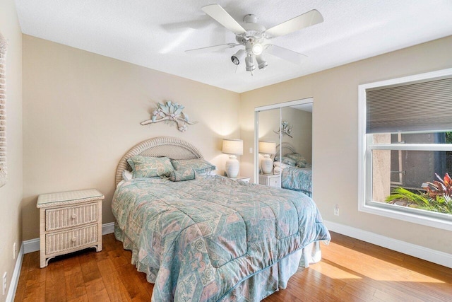 2020 Newhaven Ave, Wellington, FL 33414 - bedroom featuring wood finished floors, baseboards, a closet, and a ceiling fan