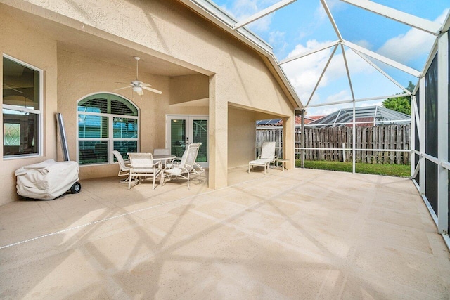 2020 Newhaven Ave, Wellington, FL 33414 - view of patio / terrace featuring ceiling fan, glass enclosure, outdoor dining space, and fence