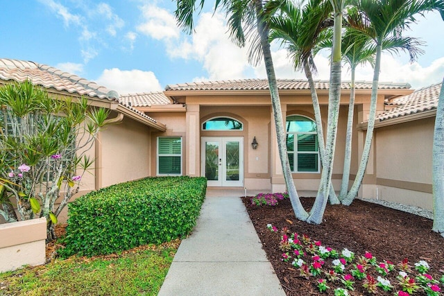 2020 Newhaven Ave, Wellington, FL 33414 - entrance to property featuring french doors, stucco siding, and a tile roof