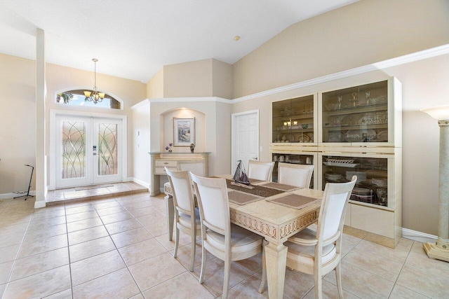 2020 Newhaven Ave, Wellington, FL 33414 - dining area featuring a chandelier, light tile patterned floors, french doors, baseboards, and high vaulted ceiling