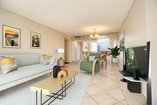 800 Parkview Dr Unit 826, Hallandale Beach, FL 33009 - living room with light tile patterned flooring, a textured ceiling, visible vents, and an inviting chandelier
