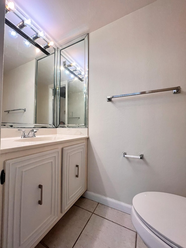800 Parkview Dr Unit 826, Hallandale Beach, FL 33009 - half bathroom featuring toilet, baseboards, tile patterned flooring, and vanity