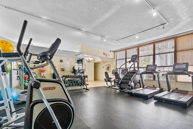 800 Parkview Dr Unit 826, Hallandale Beach, FL 33009 - workout area with rail lighting and a textured ceiling