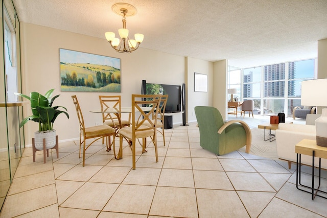 800 Parkview Dr Unit 826, Hallandale Beach, FL 33009 - dining area featuring baseboards, a textured ceiling, light tile patterned floors, and a notable chandelier