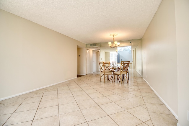 800 Parkview Dr Unit 826, Hallandale Beach, FL 33009 - dining room with light tile patterned flooring, an inviting chandelier, a textured ceiling, baseboards, and visible vents