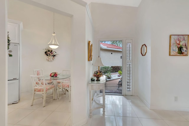 dining room featuring light tile patterned floors and baseboards