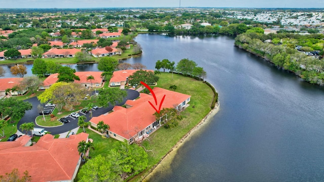 birds eye view of property with a water view