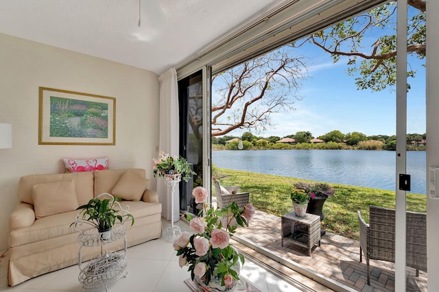 sunroom / solarium featuring a water view