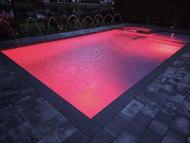 view of pool with fence