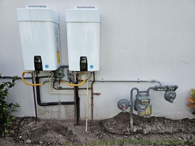 utility room featuring tankless water heater