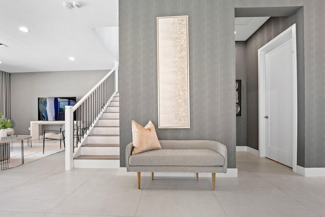 staircase with baseboards, visible vents, and recessed lighting