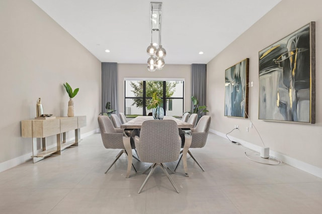 dining room featuring baseboards and recessed lighting