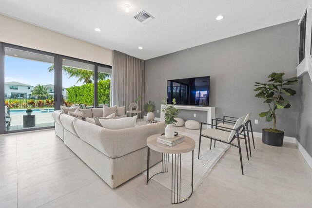 living room with visible vents, french doors, baseboards, and recessed lighting