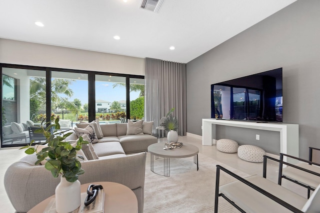 living area with visible vents and recessed lighting