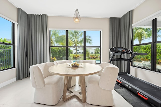 dining area featuring light tile patterned flooring and baseboards