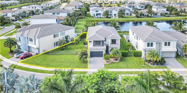aerial view with a water view and a residential view