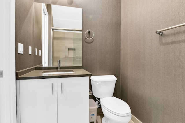 bathroom with toilet and vanity
