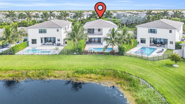 drone / aerial view featuring a water view and a residential view