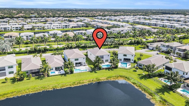 bird's eye view with a water view and a residential view
