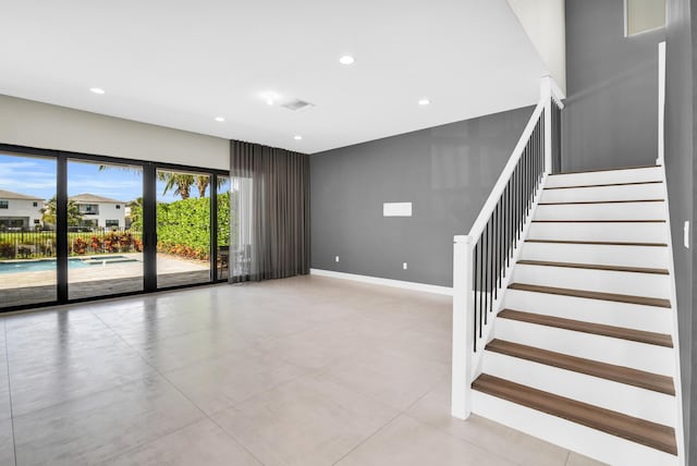 interior space featuring baseboards, visible vents, and recessed lighting
