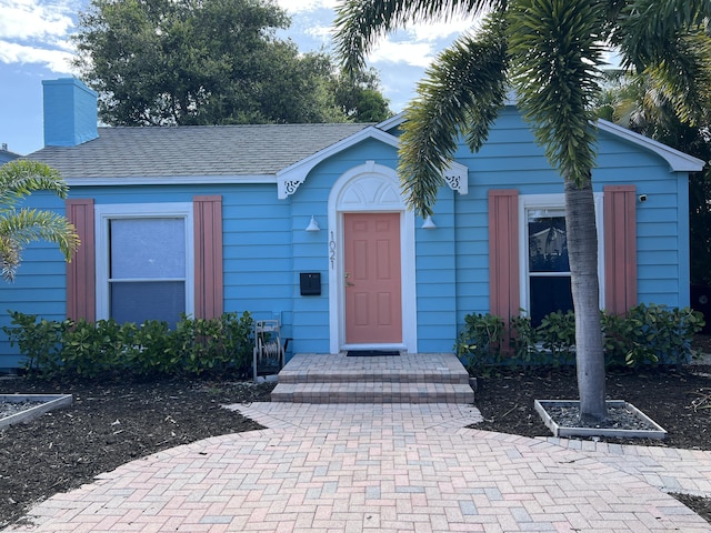 1021 N Palmway, Lake Worth Beach, FL 33460 - view of front of property featuring a chimney