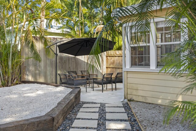 1021 N Palmway, Lake Worth Beach, FL 33460 - view of patio featuring an outdoor living space