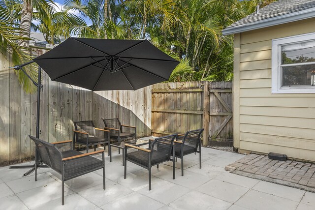 1021 N Palmway, Lake Worth Beach, FL 33460 - view of patio featuring an outdoor living space