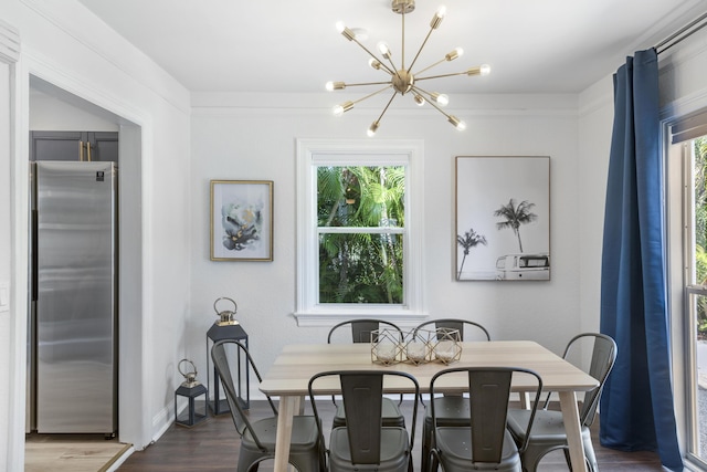 1021 N Palmway, Lake Worth Beach, FL 33460 - dining space with a chandelier, plenty of natural light, dark wood-type flooring, and baseboards
