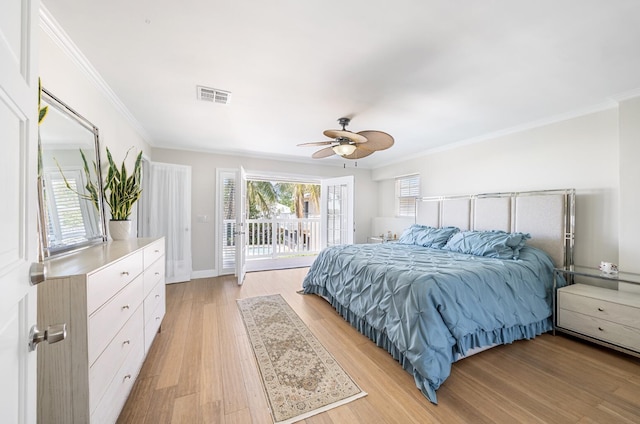 121 Queen Eugenia Ct, Hutchinson Island, FL 34949 - bedroom featuring access to outside, light wood finished floors, ornamental molding, and visible vents
