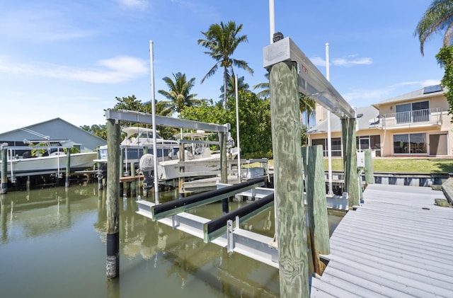 121 Queen Eugenia Ct, Hutchinson Island, FL 34949 - dock area featuring a water view and boat lift
