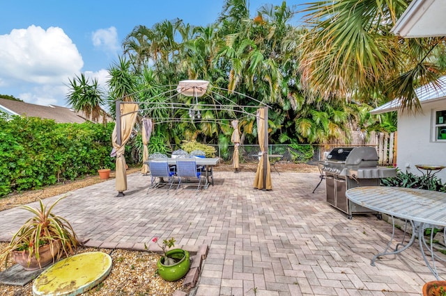3030 Phoebe Ln, Delray Beach, FL 33444 - view of patio / terrace featuring a fenced backyard, outdoor dining area, and grilling area