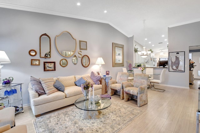 living room with light wood-style flooring, ornamental molding, baseboards, and recessed lighting