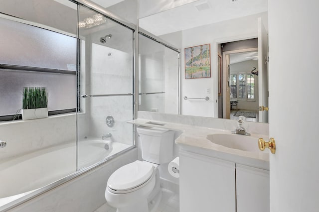 bathroom with vanity, tile patterned flooring, toilet, visible vents, and bath / shower combo with glass door