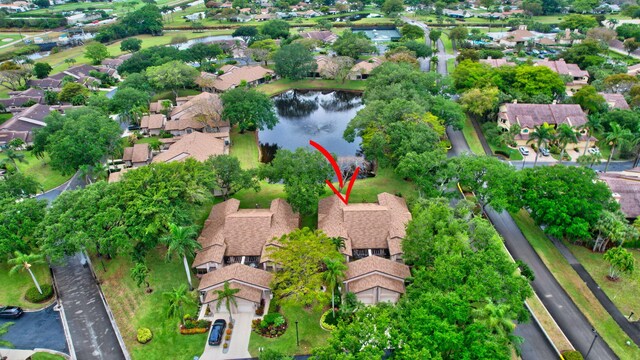 bird's eye view with a water view and a residential view