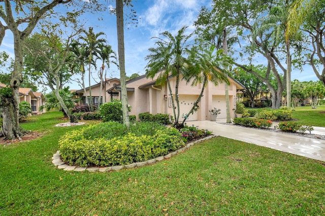 view of property exterior with an attached garage, a yard, concrete driveway, and stucco siding