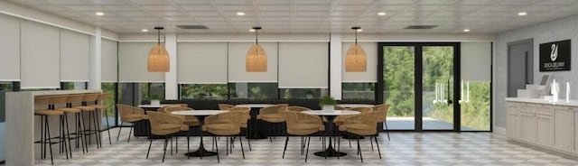 dining area with tile patterned floors and recessed lighting