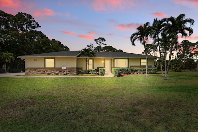 12109 53rd Rd N, The Acreage, FL 33411 - ranch-style home with stone siding, stucco siding, and a front yard