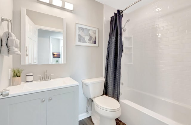 full bathroom with toilet, wood finished floors, shower / bath combo with shower curtain, and vanity