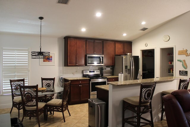 kitchen featuring visible vents, recessed lighting, stainless steel appliances, backsplash, and light stone counters