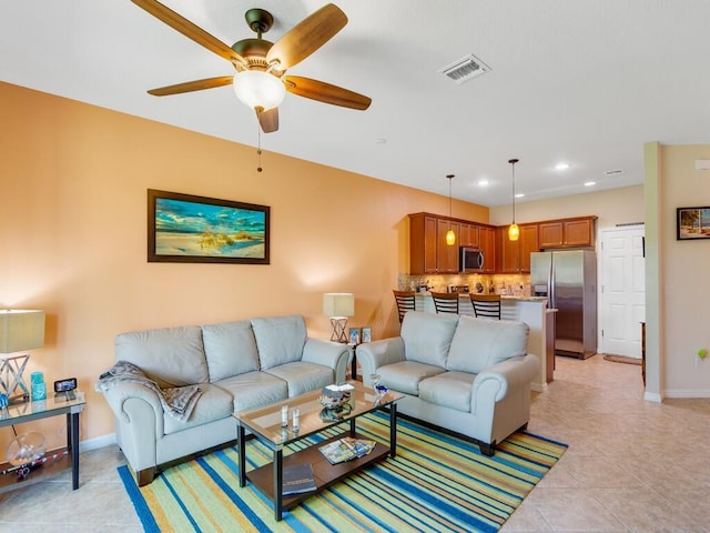 living area with ceiling fan, baseboards, light tile patterned floors, and recessed lighting