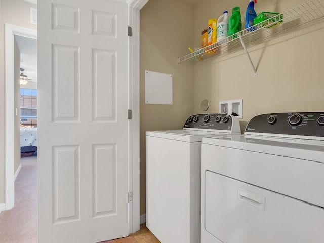 washroom with washer and clothes dryer, ceiling fan, and baseboards