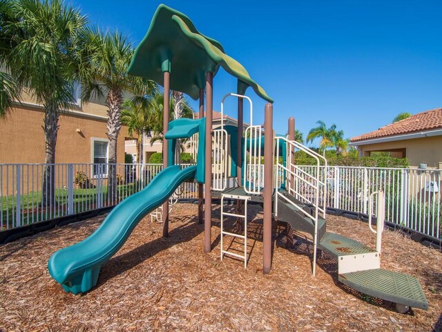 community jungle gym featuring fence