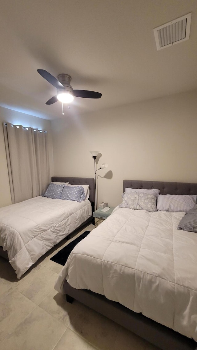 bedroom featuring a ceiling fan and visible vents