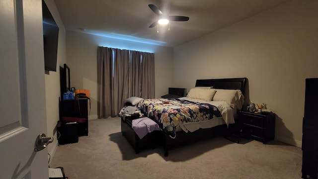 bedroom with light carpet and ceiling fan