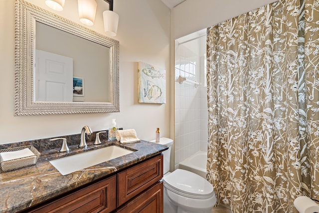 full bath featuring shower / tub combo with curtain, toilet, and vanity